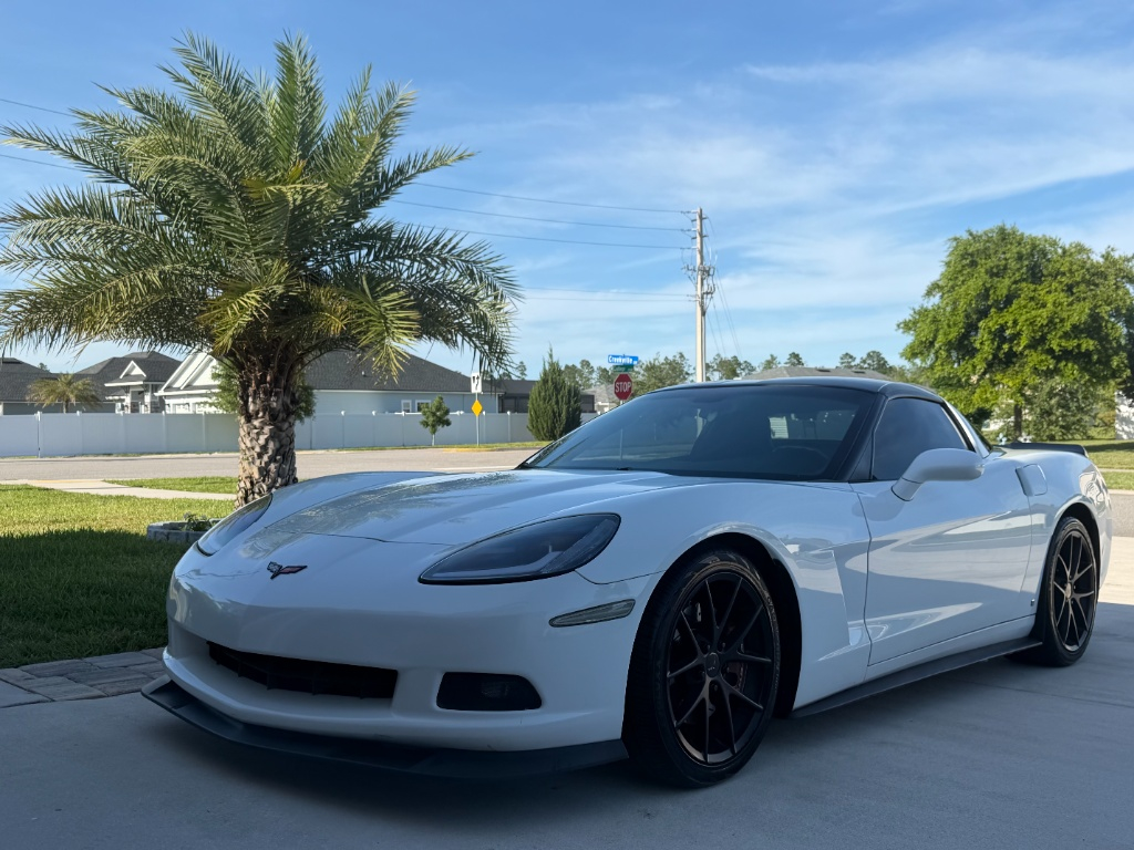 White Corvette after BackLab full detail — paint restored, wheels blacked out